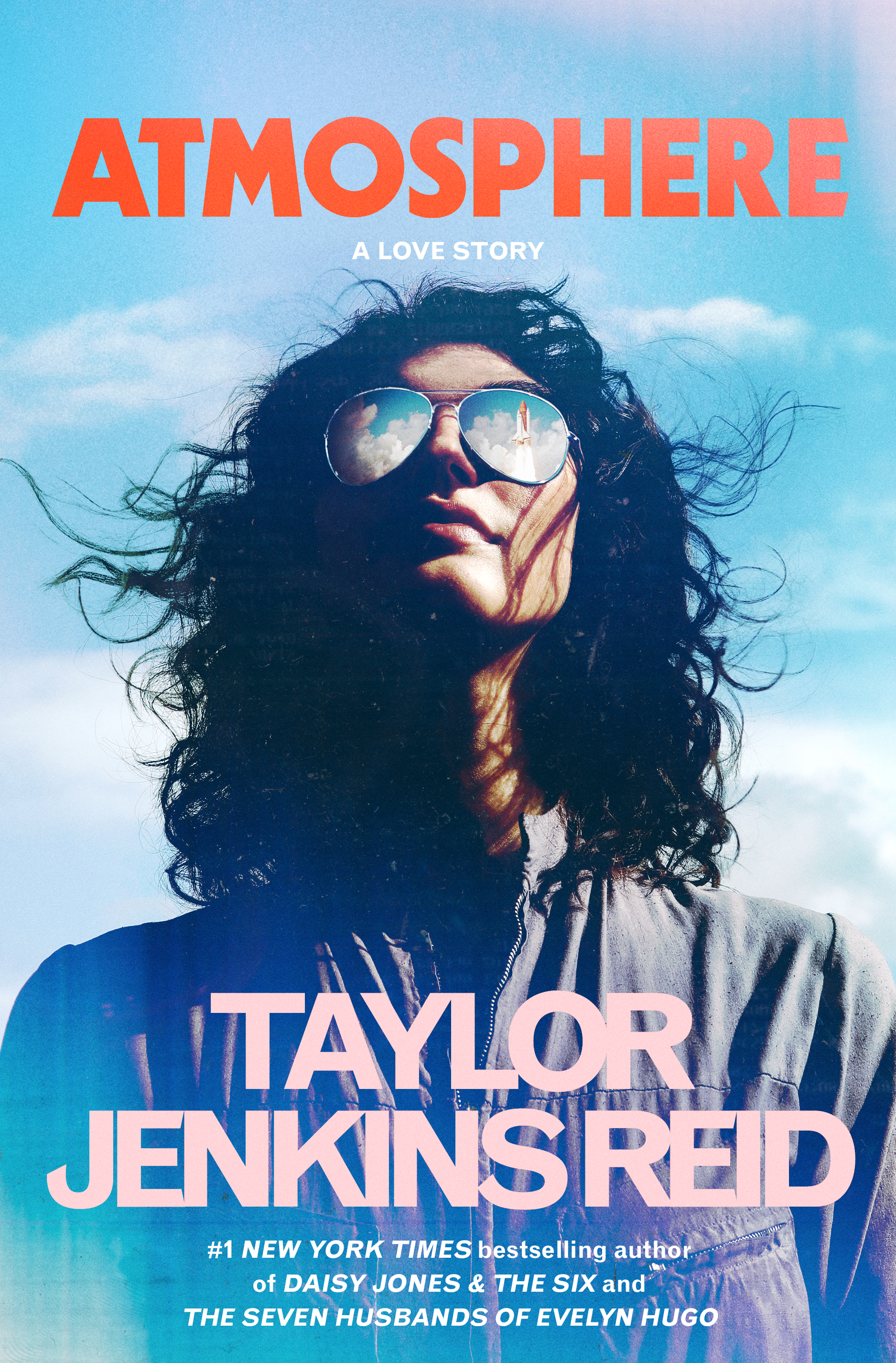Atmosphere by Taylor Jenkins Reid, orange and blue cover showing a shuttle reflected in sunglasses